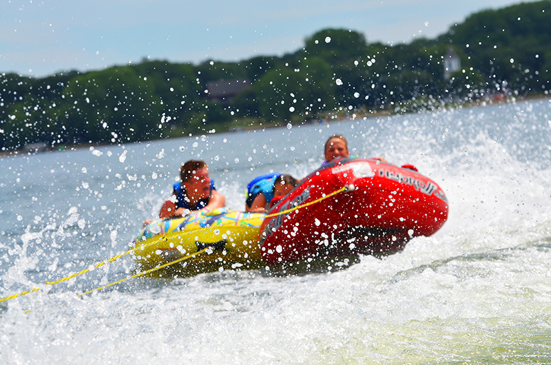 kids-tube-bouncing So many North Dakota Lakes near Grand Forks