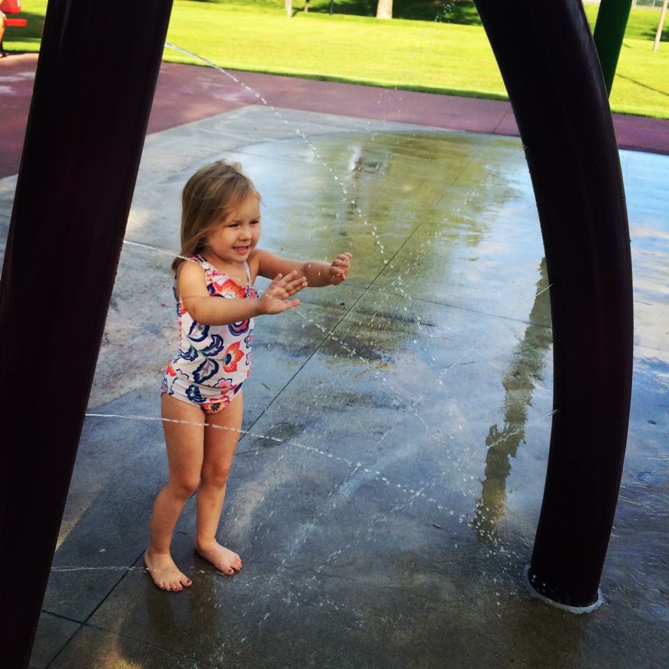 Child Playing at University Park Splash Park In Grand Forks North Dakota the Best City to Raise a Family