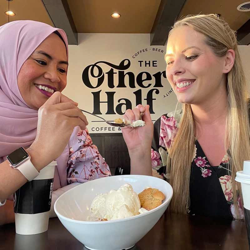 sharing-dessert-at-the-board-room Fifi and friend sharing a sweet treat in Grand Forks