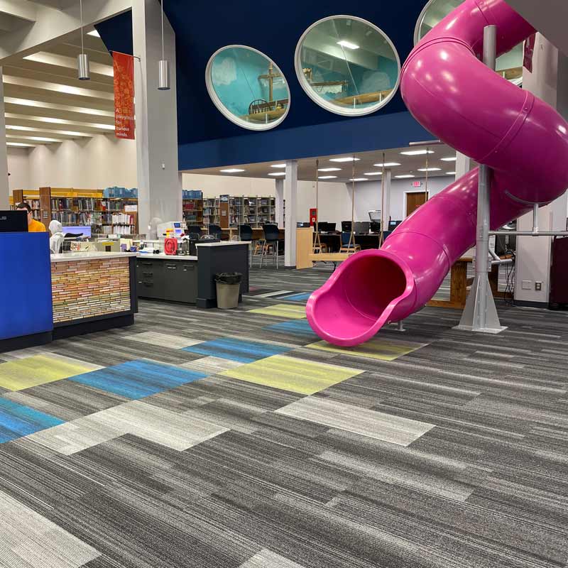 Grand Forks Public Library slide Pink twisty-slide in Grand Forks Public Library