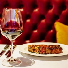 Harrys Steakhouse in Grand Forks Glass of wine and plate of food in Grand Forks, North Dakota Restaurant