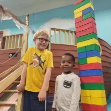 grand-forks-library Two boys at the Grand Forks library with pirate ship and legos