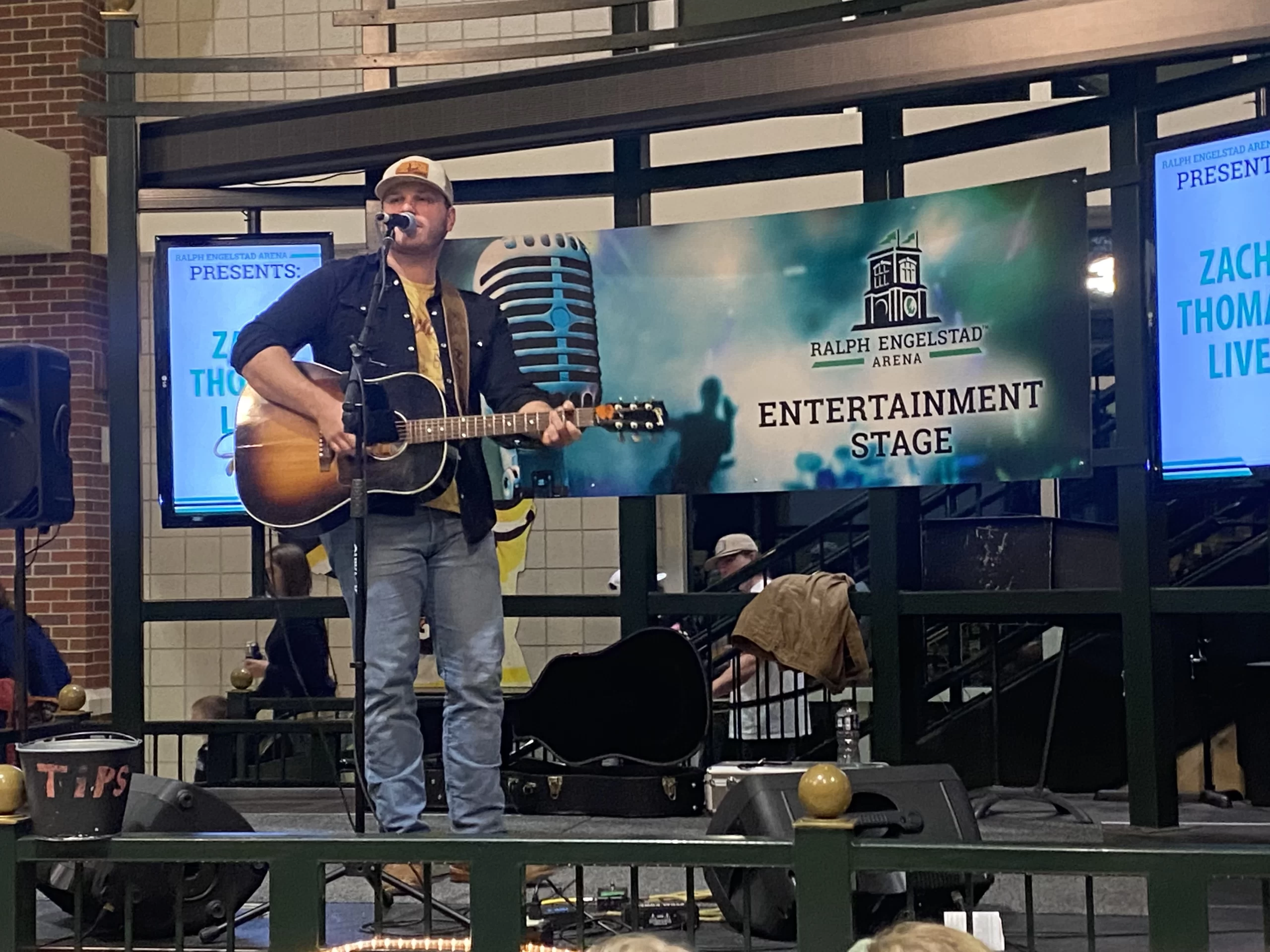 live-music-ralph-engelstad Man sings on stage at Ralph Engelstad arena in Grand Forks at UND Hockey game.