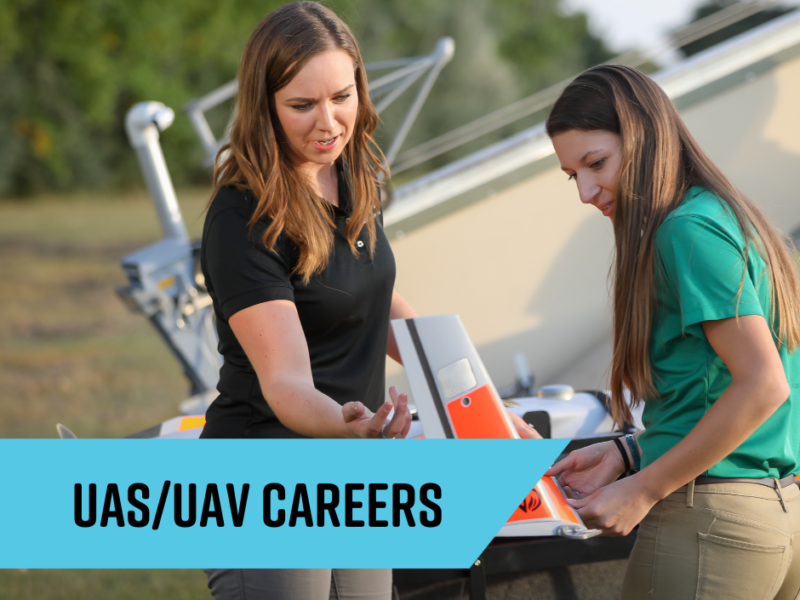 Grand Forks UAS Careers Two women working on UAS equipment a drone in the forefront. A man looks on from the background, standing next to a large unmanned vehicle.