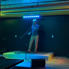Open Mic NIght at Half Brothers in Grand Forks, ND Man standing on a stage at an open mic night in the basement of Half Brothers brewing company