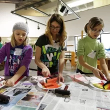 kids-art-class-square Three girls participating in an art class.