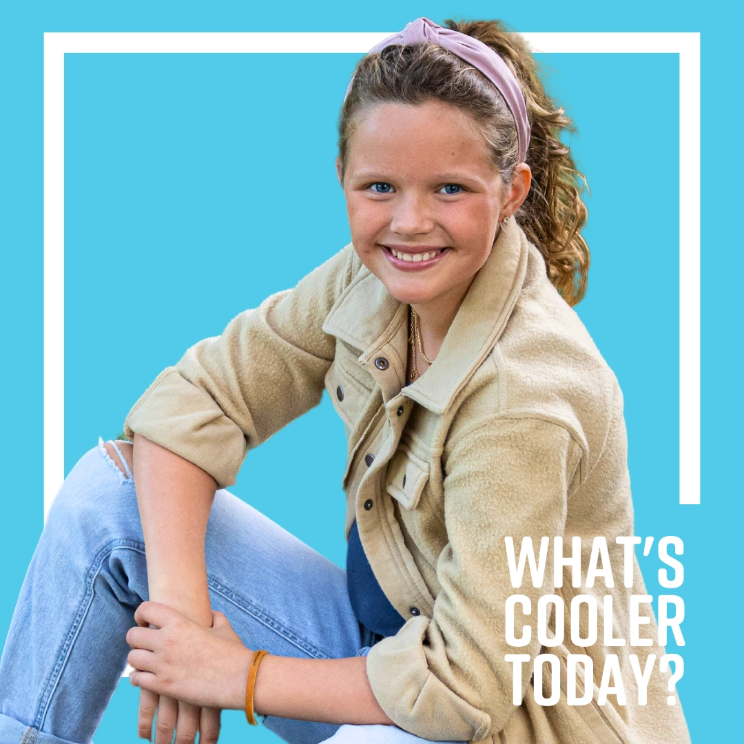 brae-webp-headshot What's Cooler Today author Brae sits in a casual pose. She is surrounded by a blue graphic that reads "What's Cooler Today?"