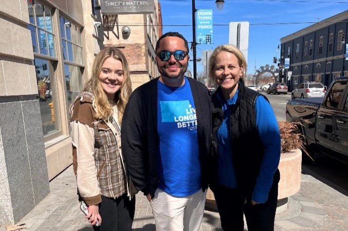 kenneth-blue-zones-walk WCT writer Kenneth stands with two female Blue Zones employees while wearing a Grand Forks Blue zones shirt