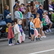 kids-love-it Kids standing waiting for candy at the Potato Bowl parade in Grand Forks.