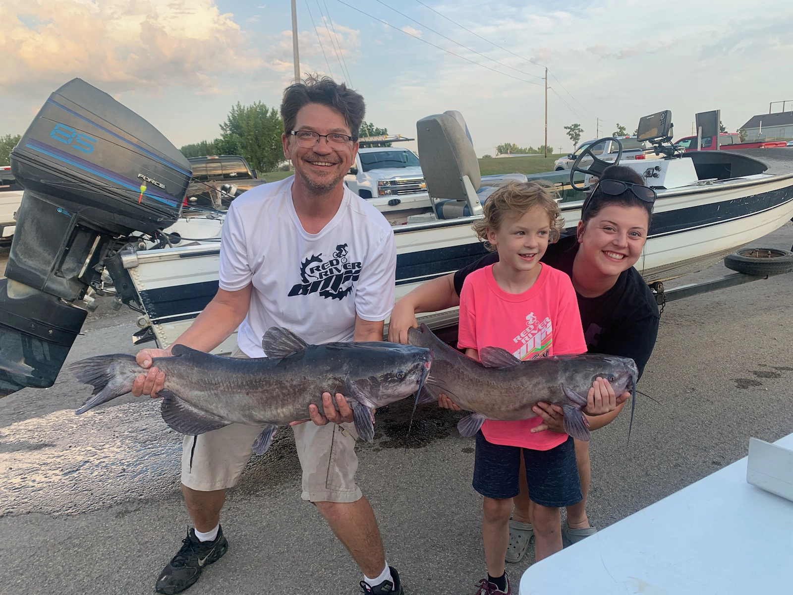 avery-winning-fish (left to right) Wade Anderson, Avery Anderson, and a volunteer from the Red River Valley Catfish League; July, 2023 on the Red River. Fish species: Channel Catfish.