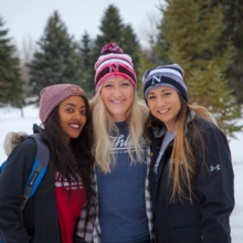 Northland Students in Grand Forks Best College Town Grand Forks Colleges Three female Northland Community and Technical College students stand outside on campus sporting their NCTC gear.