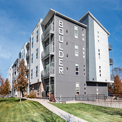 Boulder Apartments Grand Forks Boulder Apartments. Gray facade with asymmetrical designs.
