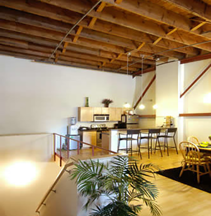opera house lofts APPROVED Inside of an Opera House loft in Grand Forks. Tall curved ceilings with open concept. Lots of light wash wood and a smaller but decent sized kitchen.