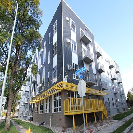 University Flats University Flats Grand Forks exterior. Multishades of gray on the outside sidig. Lots of windows and Yellow metal steps into the entrance.