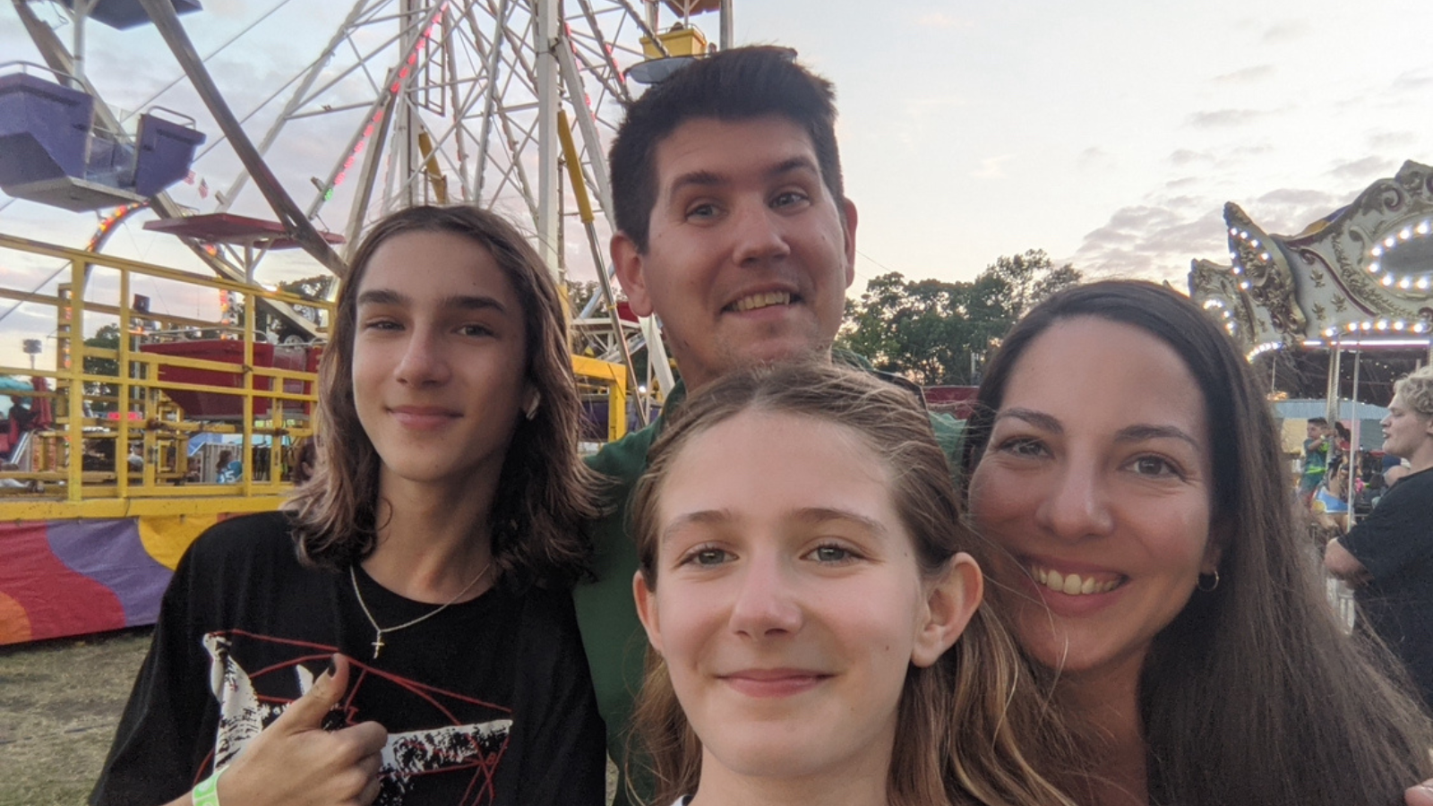 Author Bru is pictured with his family in front of the county fair ferris wheel!