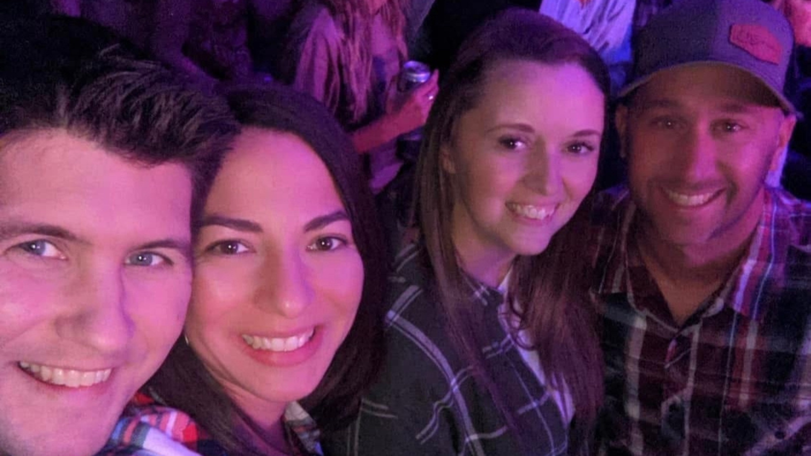 Author Bru is pictured on the far left with his wife and their two friends sitting next to them at a concert.