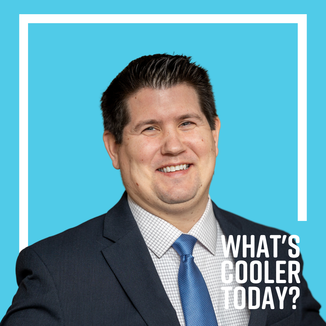 Author Bru poses in a suit for his What's Cooler Today headshot!