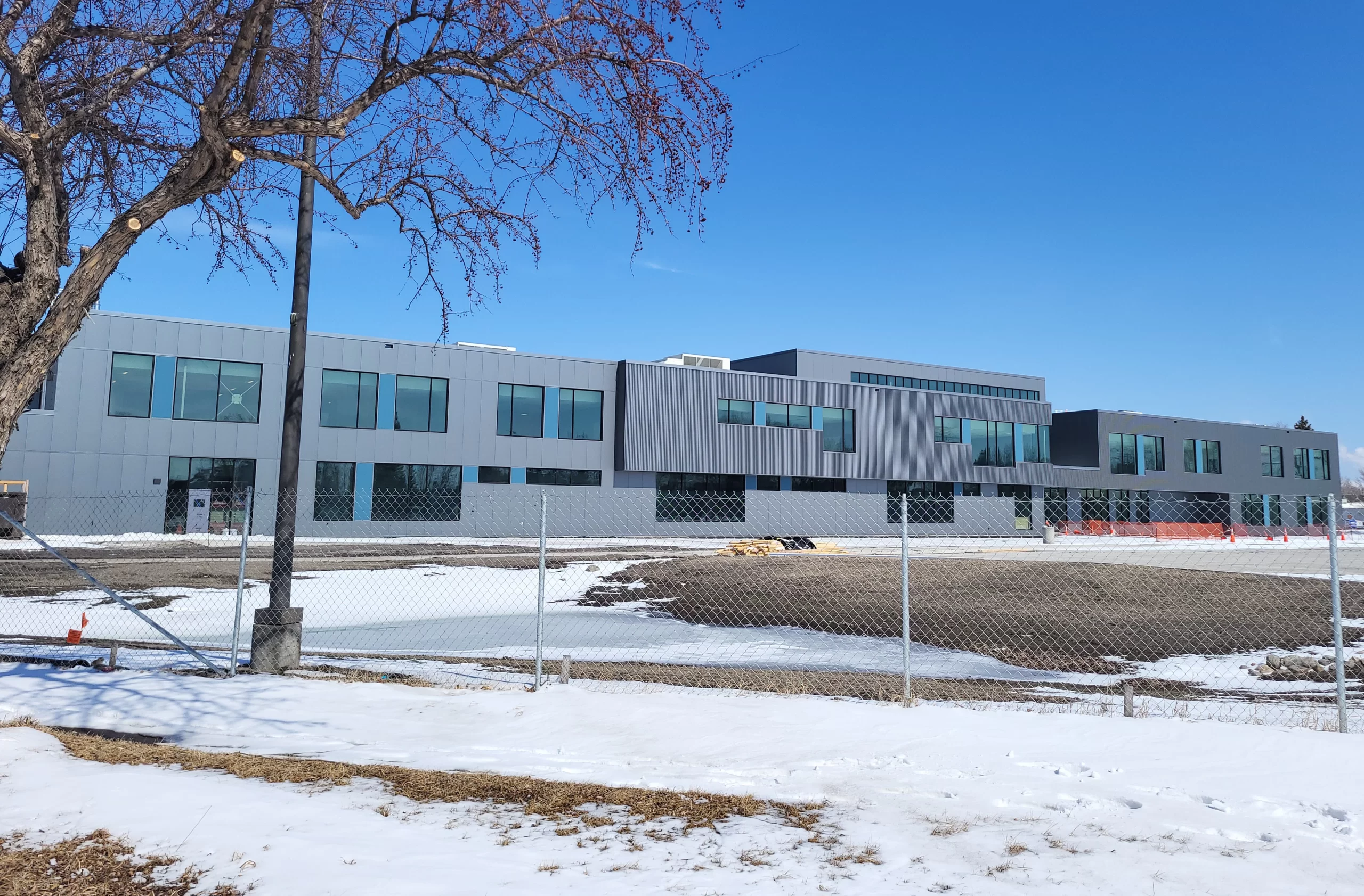 Career Impact Academy Construction Photo This photo shows the exterior of the current Career Impact Academy being built. It is all shades of grey and has loads of windows!