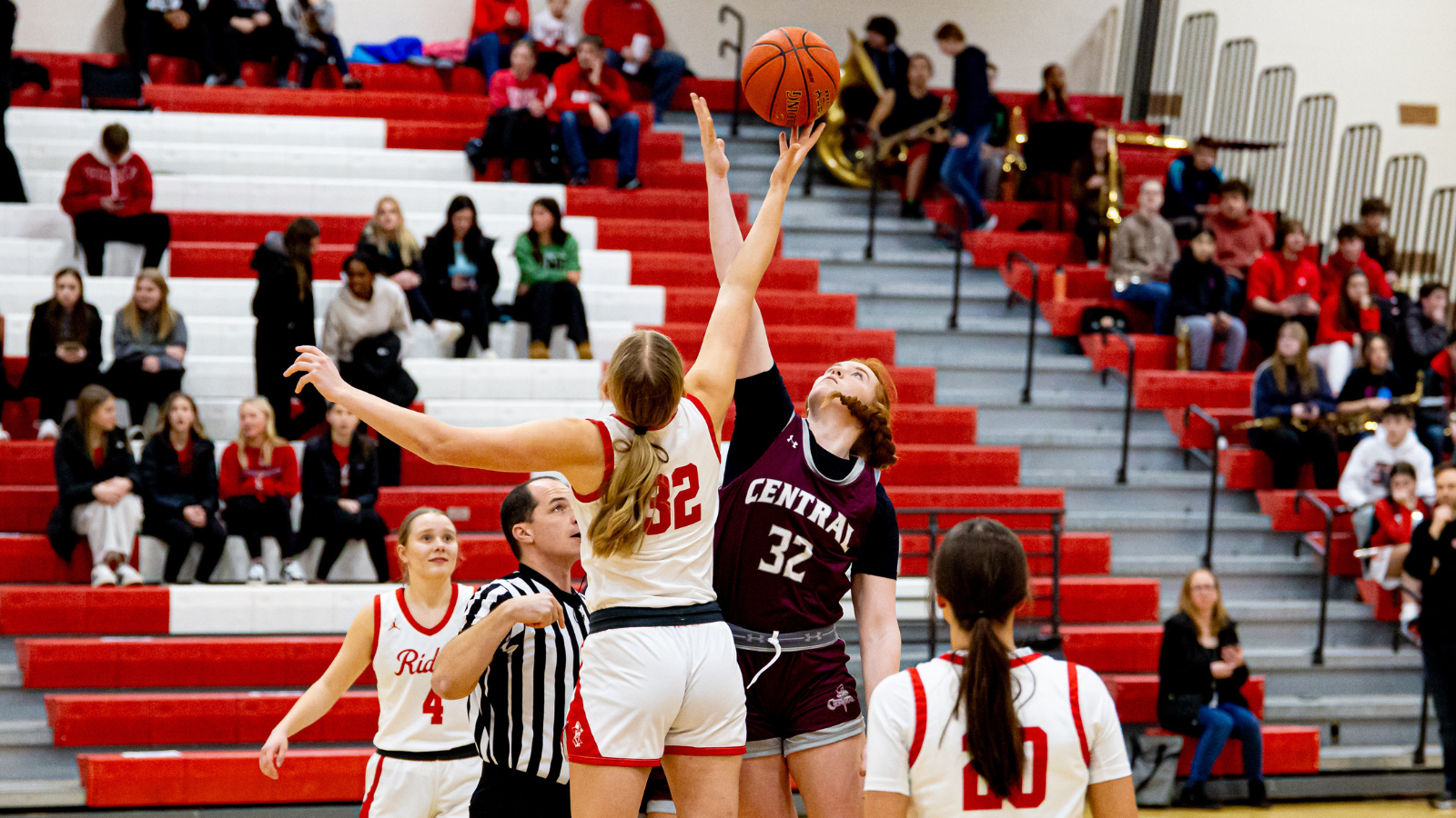Red River vs. Central Girls Basketball Game Tip-off A girls basketball game, two players tip-off the ball.