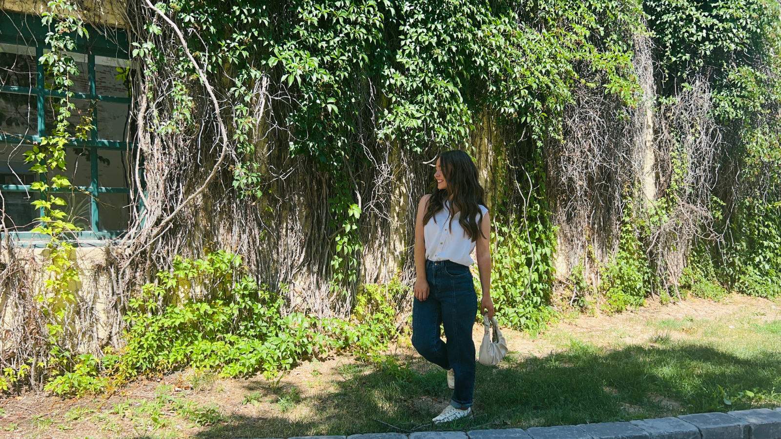 Natalie Ely's Ivy Wall Author Natalie poses in front of the large ivy wall downtown outside Ely's Ivy