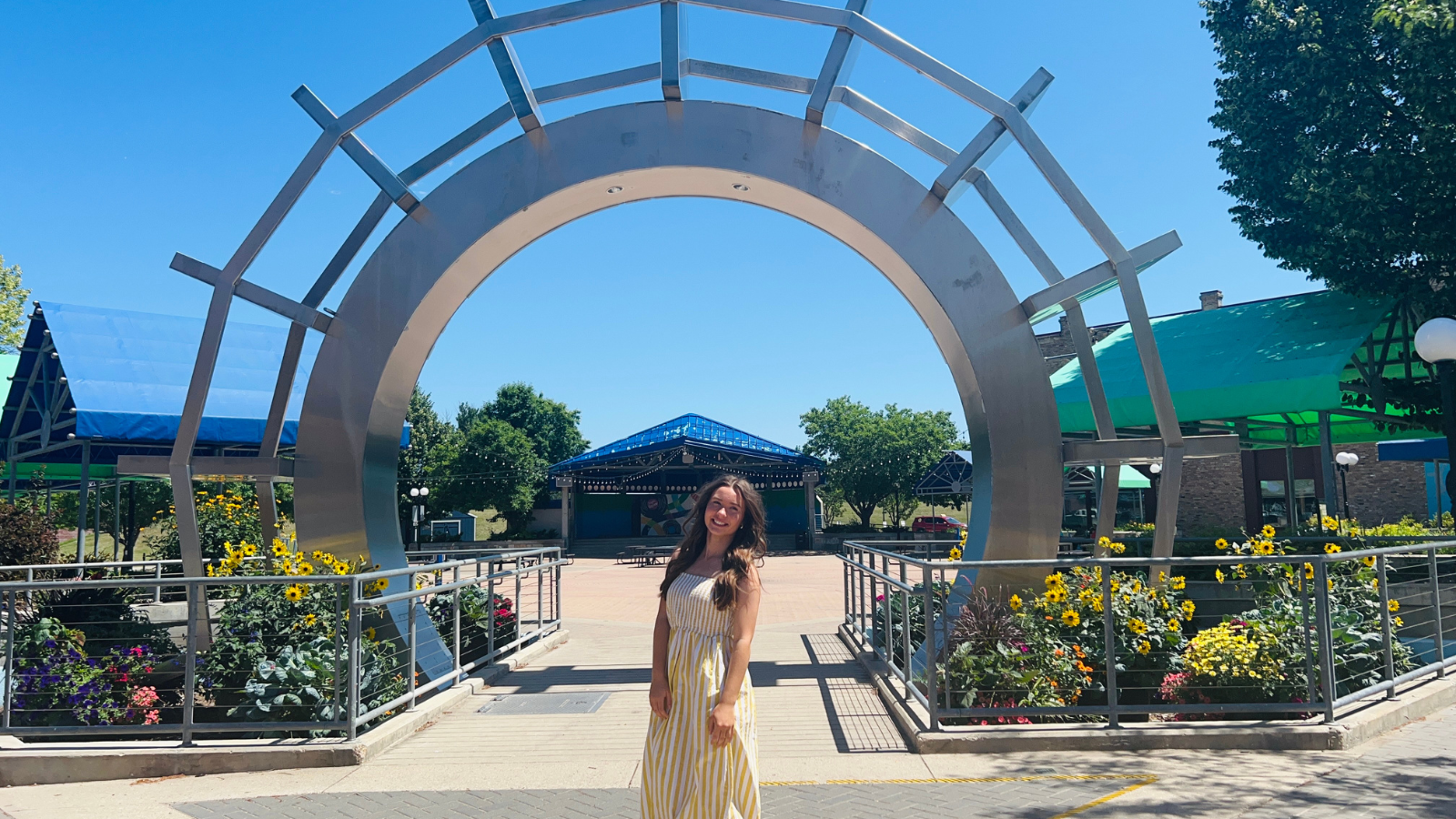 Natalie Lund Townsquare photo Author Natalie poses under the townsquare arch in Grand Forks