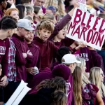 the stands with Central High School students cheering on football