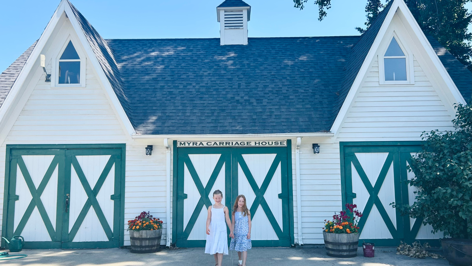Myra museum photo The Myra Museum at the Heritage center gets a straight shot with the camera and two young girls facing the lens.