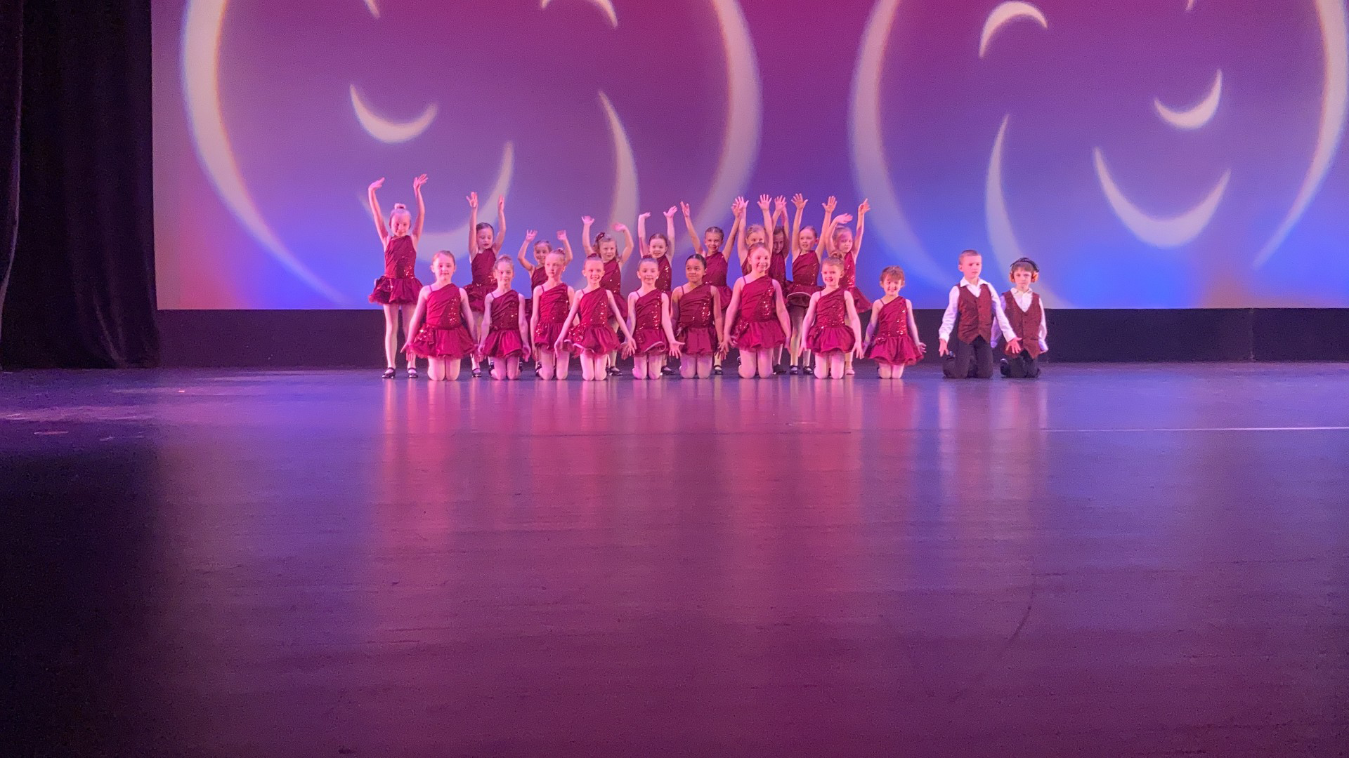 Author Natalie Dance Group Author Natalie is shown dancing in a group as a child up on stage.