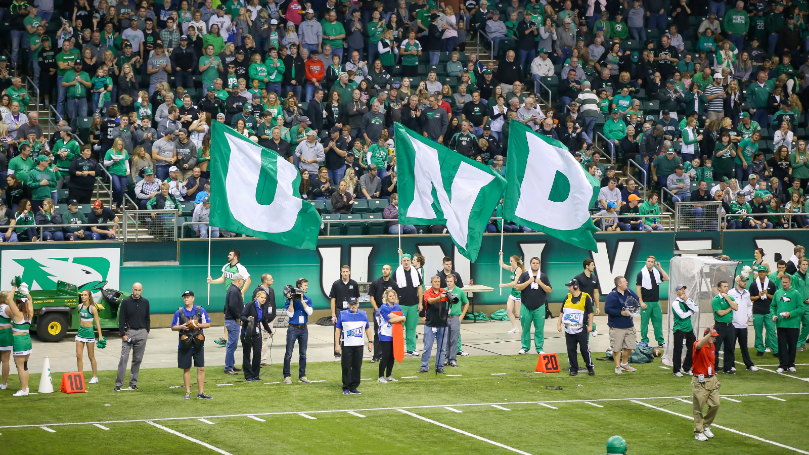 UND Football Stadium Fans A UND football team has an eager fan base in the stands. The flags are ready.
