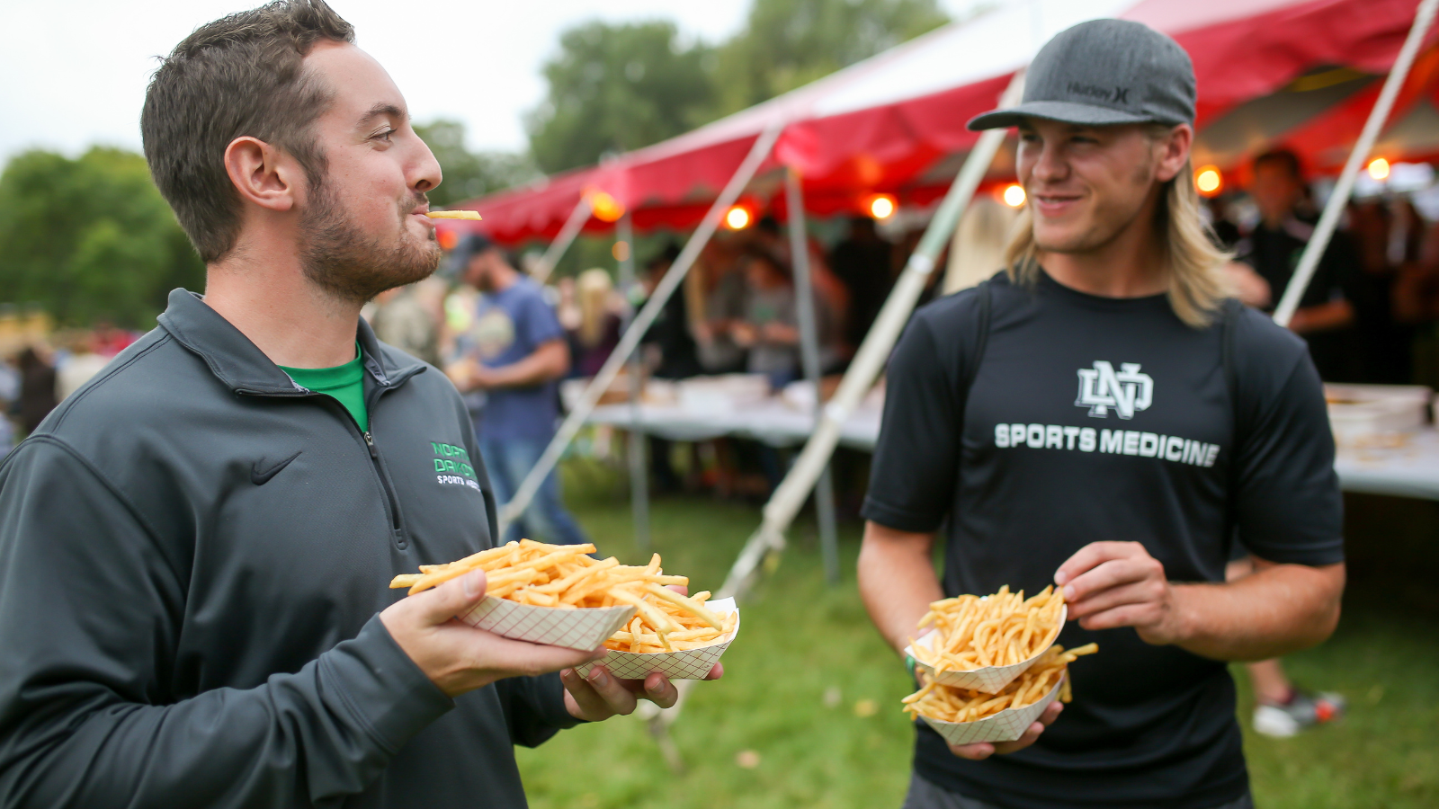 French Fry Feed Attendance Two men attend the French Fry Feed in University Park